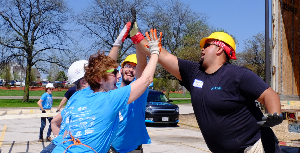 Celebrating the completion of our wall with my team last spring at Women Build.